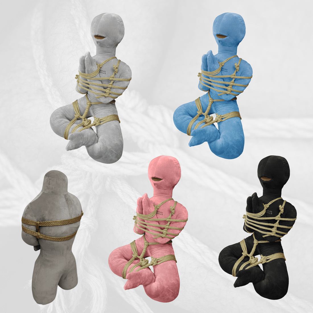 Five shibari practice dolls in different colours and body types, tied in rope